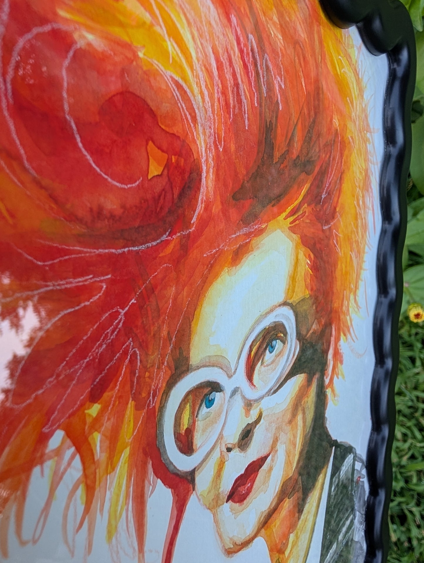 Original mixed media portrait of Vivienne Westwood with orange red hair white glasses and Get a Life Foundation shirt in black wavy frame