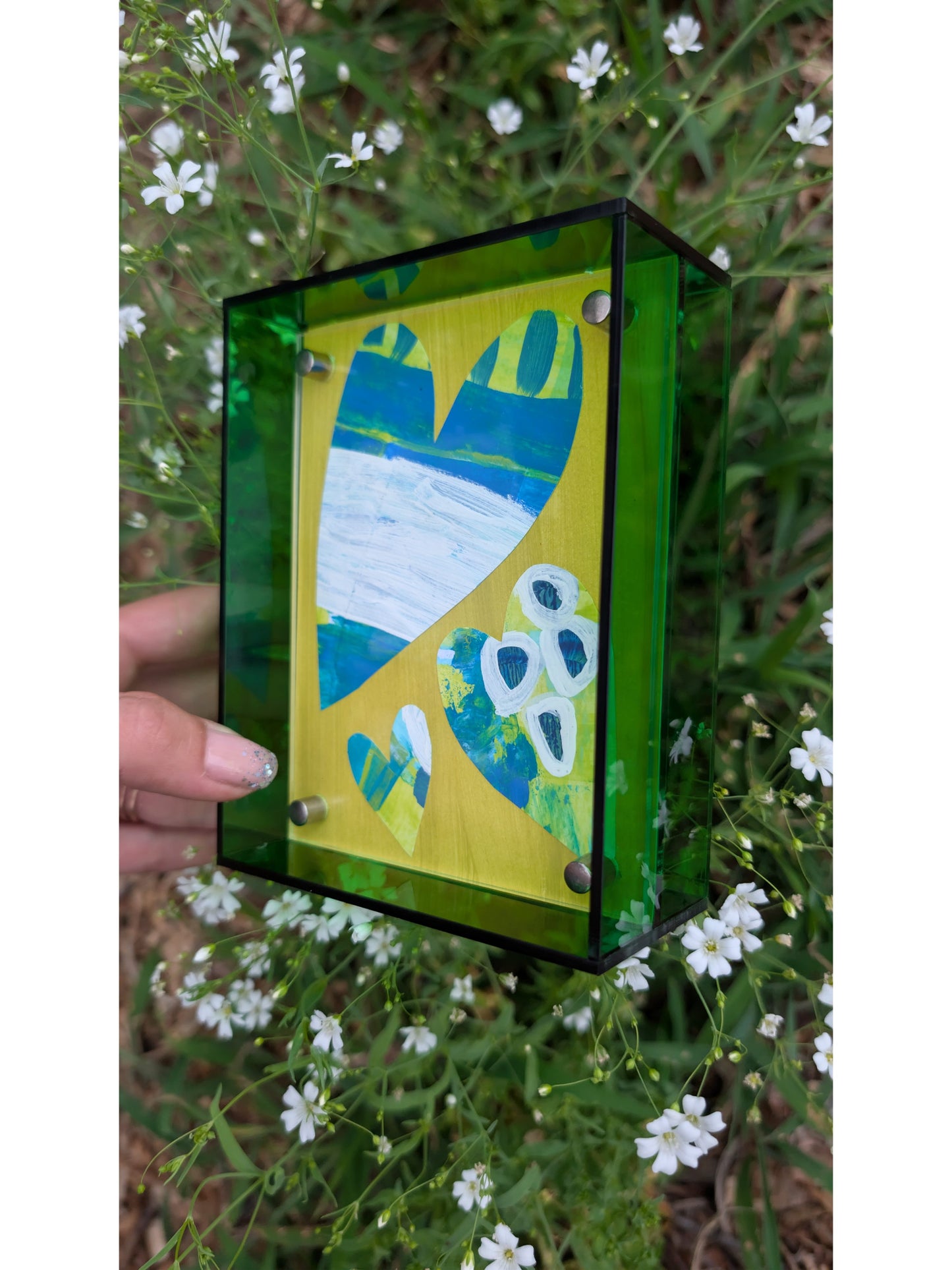 Small original heart collage with blue green and white hand-painted paper hearts on lime green background in bright green acrylic float frame