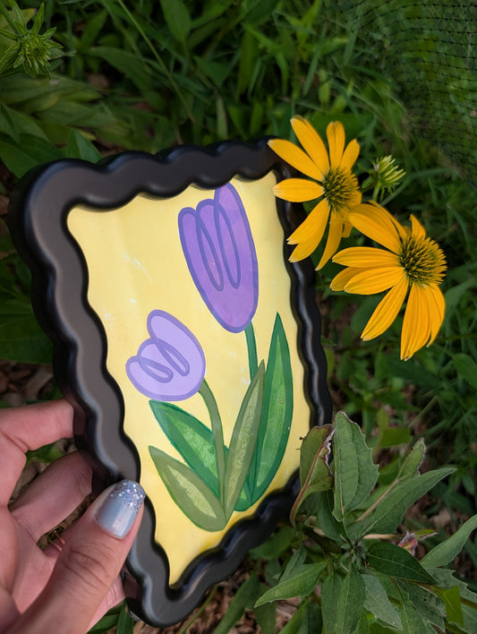 Original acrylic painting of whimsical purple tulips on yellow background in black wavy picture frame