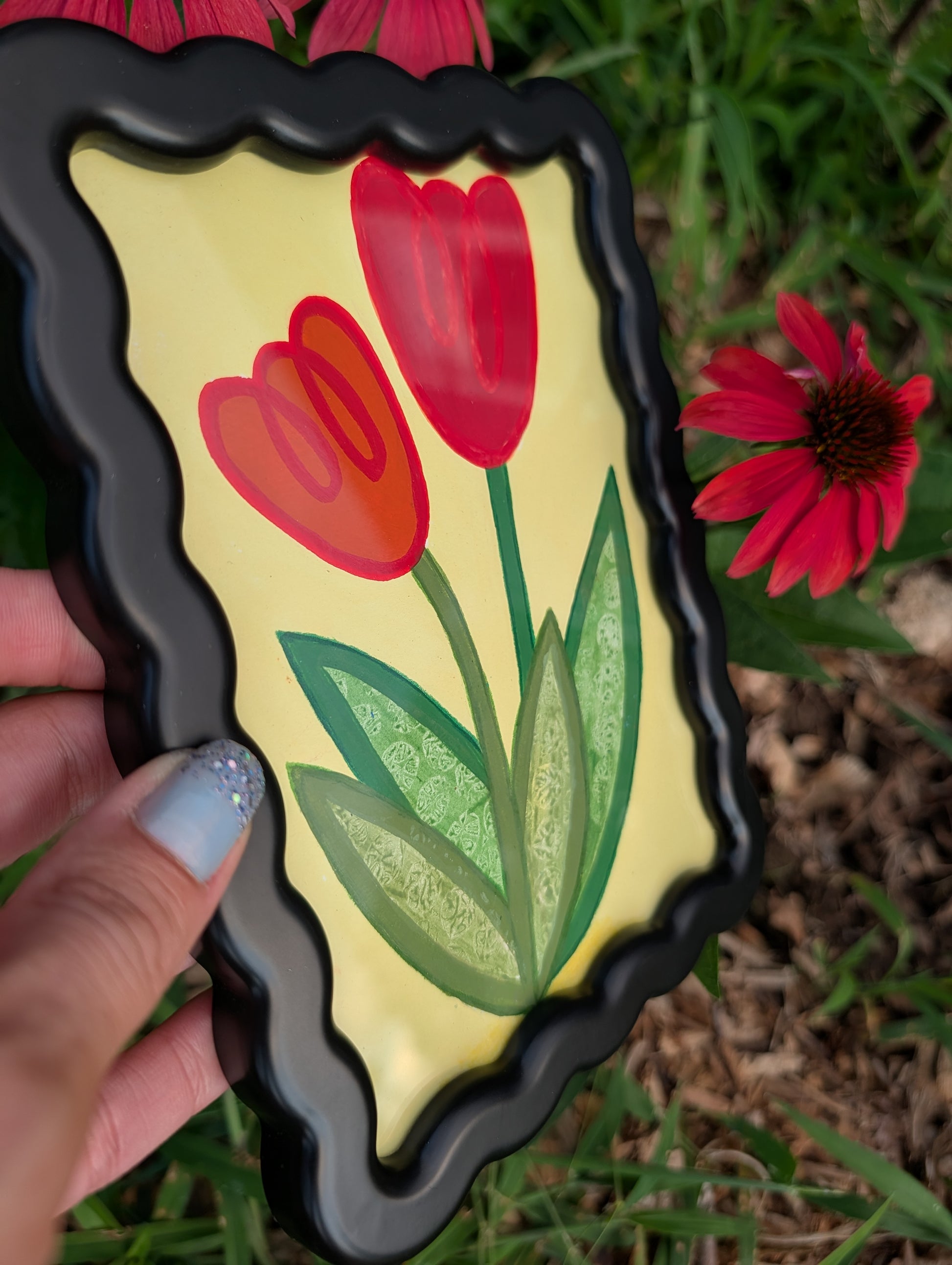 Original acrylic painting of whimsical red tulips on yellow background in black wavy picture frame
