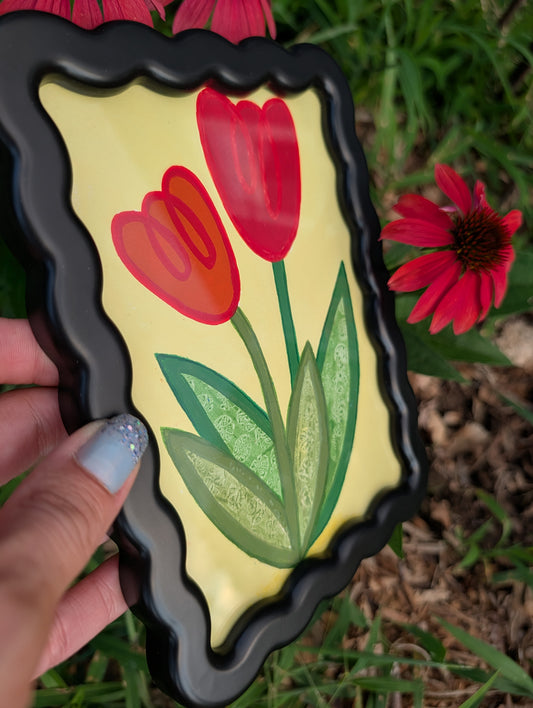 Original acrylic painting of whimsical red tulips on yellow background in black wavy picture frame
