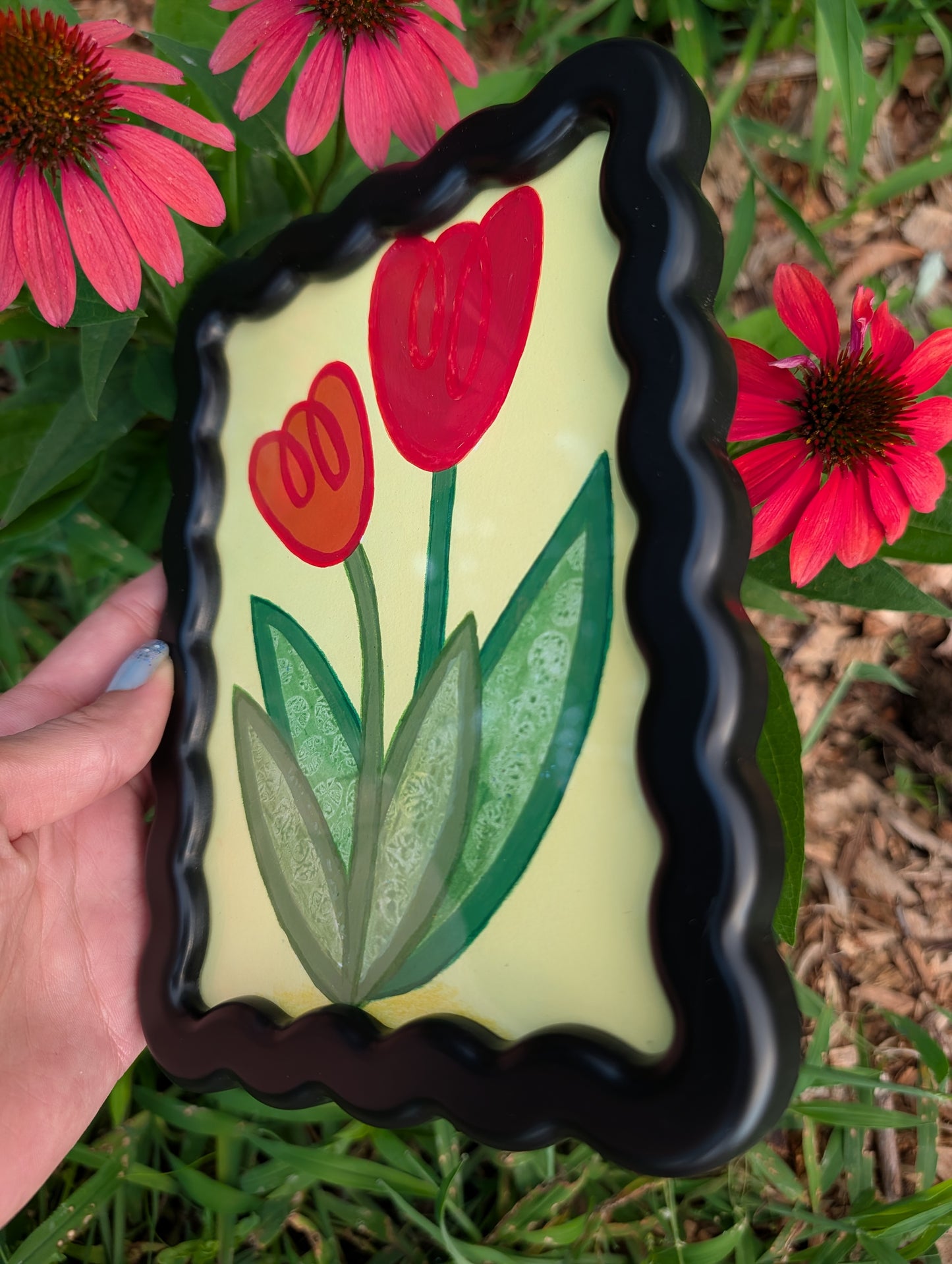 Original acrylic painting of whimsical red tulips on yellow background in black wavy picture frame
