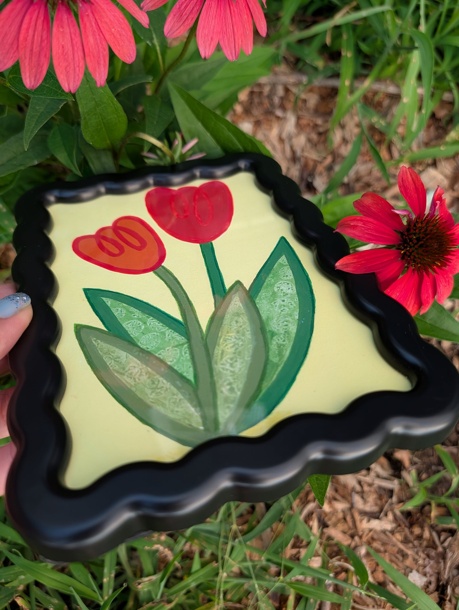 Original acrylic painting of whimsical red tulips on yellow background in black wavy picture frame
